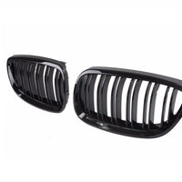 Vedere frontală a setului complet de grile frontale pentru BMW Seria 3 E92/E93 (2006–2009), finisaj Piano Black, design sportiv, material ABS.