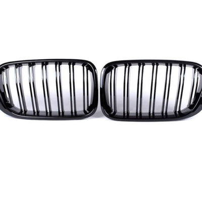 Set grile față BMW X3 F25 (2014–2018), design dublu-rinichi M Look, finisaj negru lucios, plastic ABS rezistent, vedere frontală pe fundal alb.