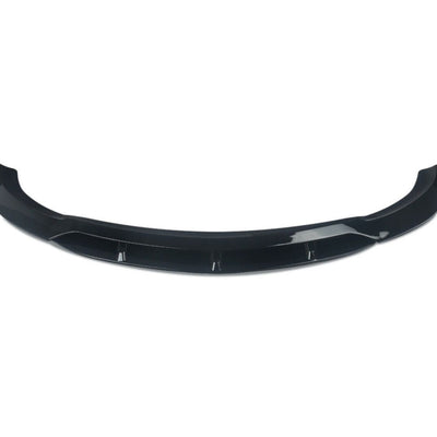 Prelungire bară față BRABUS pentru Mercedes-Benz E-Class W213 (2016-2019), piesă aftermarket din fibră de carbon, culoare negru lucios, vedere frontală pe fundal alb.