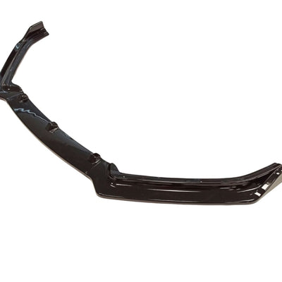 Prelungire bară față Volkswagen Polo 2009-2017 MK5, piesă aftermarket neagră, vedere laterală în unghi pentru detalii de design.