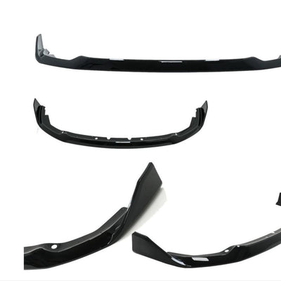 Piese individuale din kitul Aero M-Tech pentru BMW F40, în culoare negru lucios. Afișează detaliile componentelor splitterului frontal și designul agresiv al spoilerului.