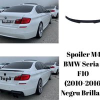 Imagine detaliată a spoilerului tip M4 Look pentru BMW Seria 5 F10 (2010-2016), piesă auto aftermarket din plastic ABS, finisaj negru brillant.
